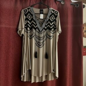 Women’s country western style top with a V-neck and black hanging ropes